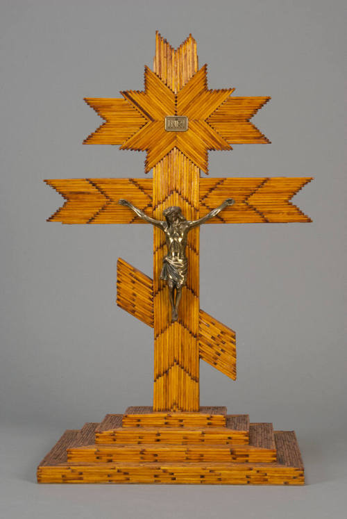Match stick cross with large silver metal Christ