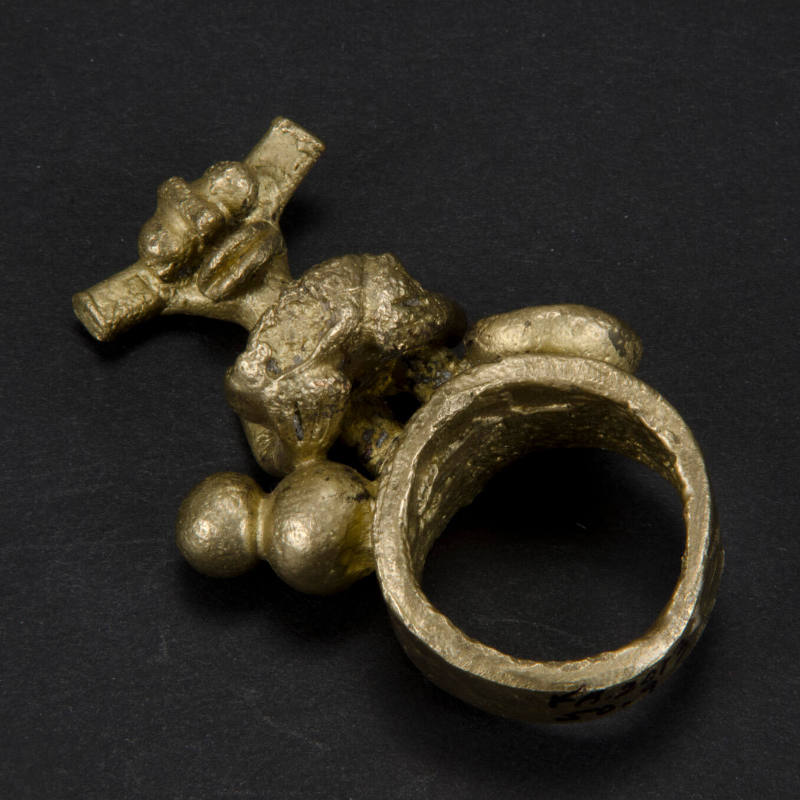 Ring with standing figure