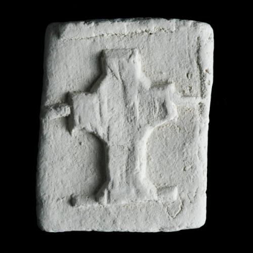 Sacred clay tablet with large cross in center