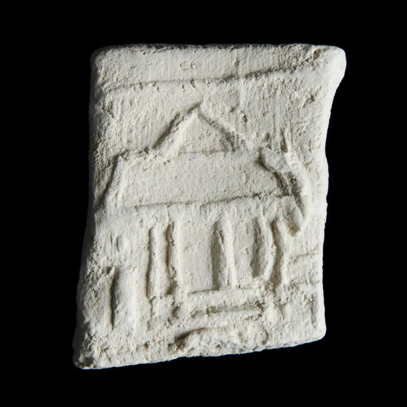 Sacred clay tablet with linear architectural design