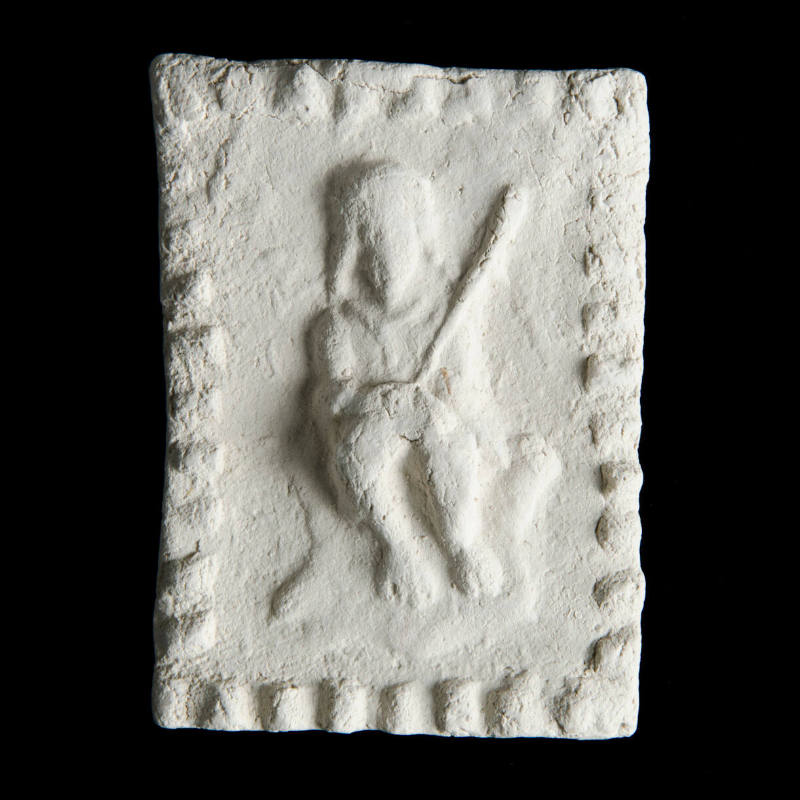 Sacred clay tablet with figure of "God in Need"