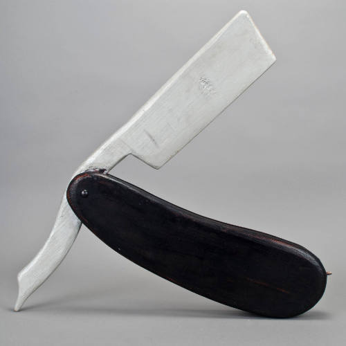 Barber's straight edge razor sculpture