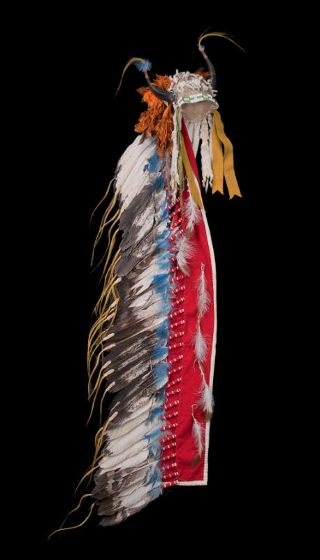 Horned headdress with feather trailer