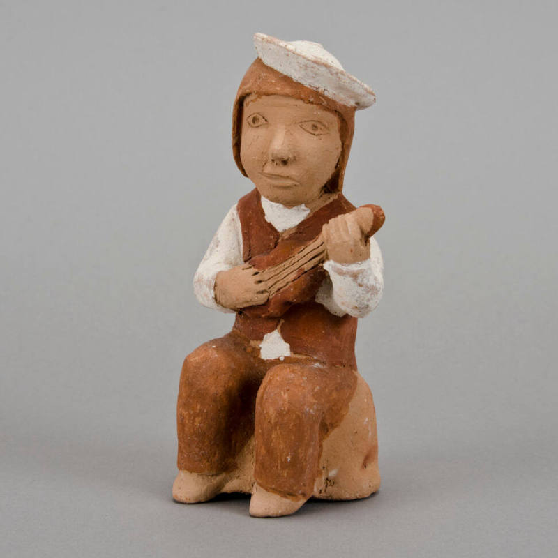 Figural whistle, man playing charango