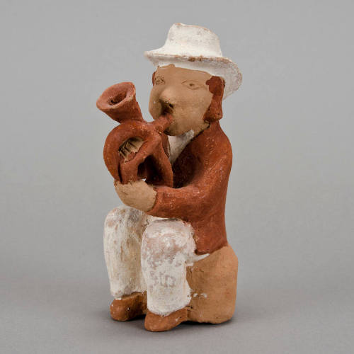 Figural whistle, man playing horn