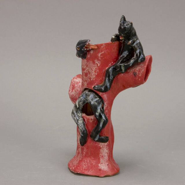 Devil and serpent figure