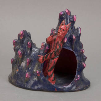 Devil in cave sculpture