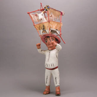 Figure Carrying a Torito de Fuego