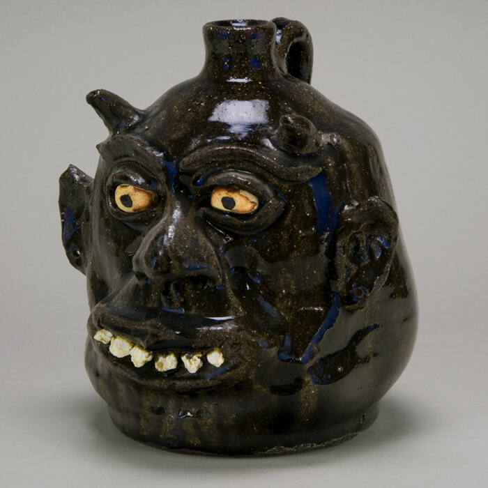 Devil face jug