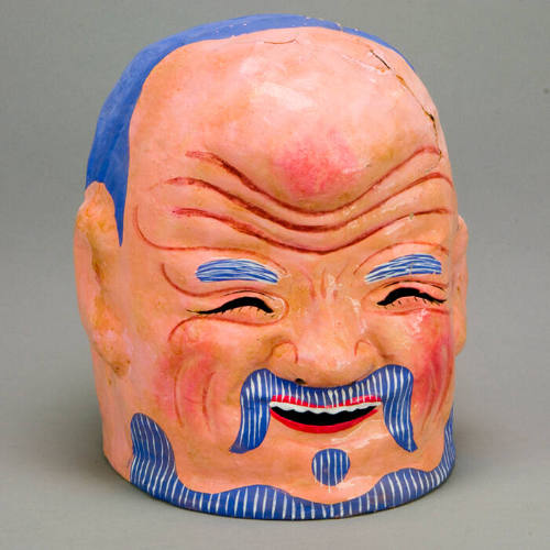 Mask of the Elderly Man, sometimes referred to as the Buddha, who taunts and tames the lion